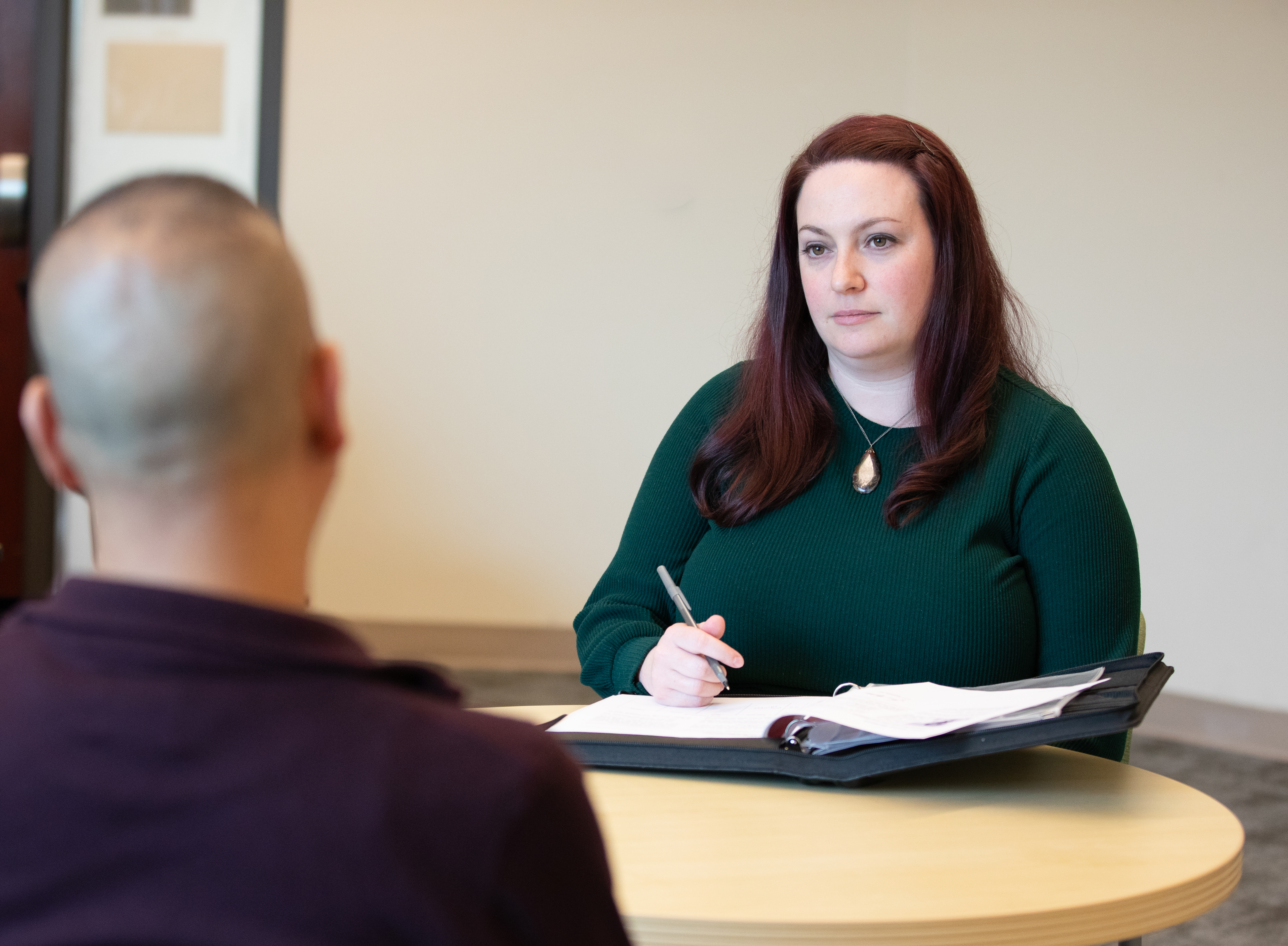 Woman interviewing man